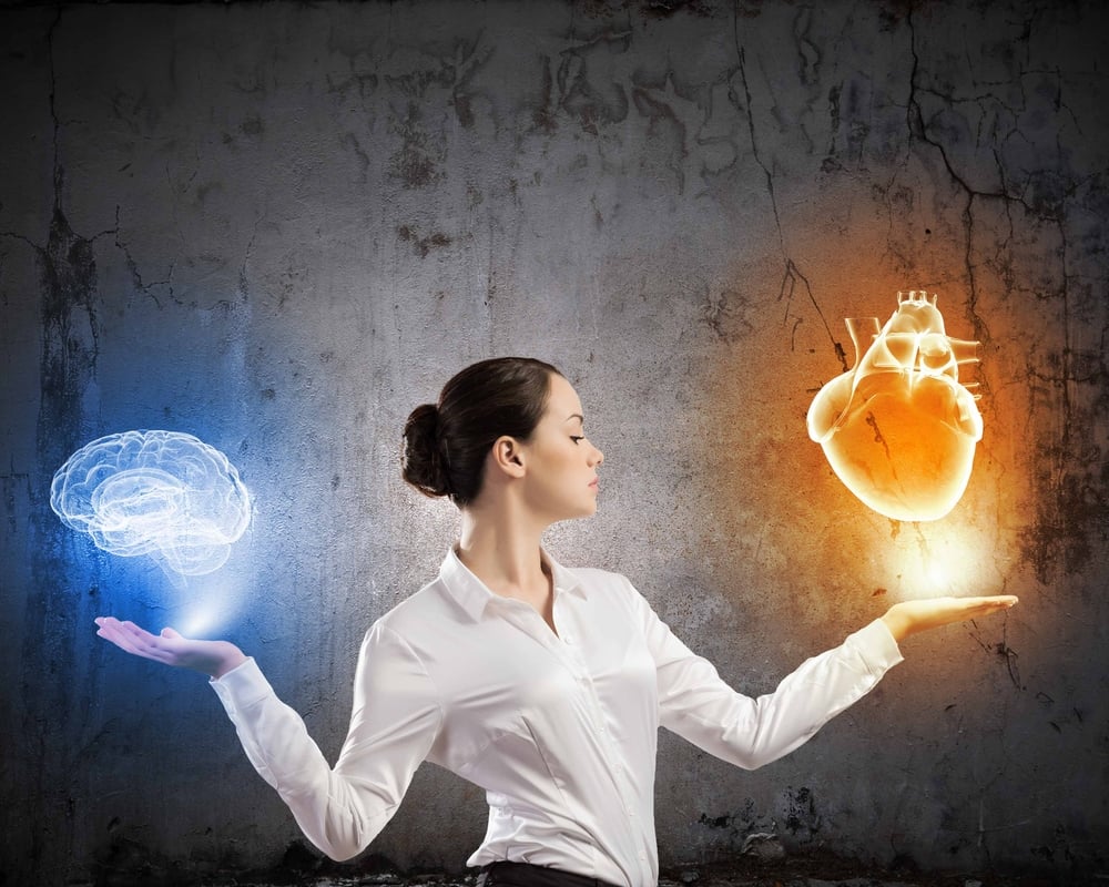 Image of businesswoman balancing with items in palms