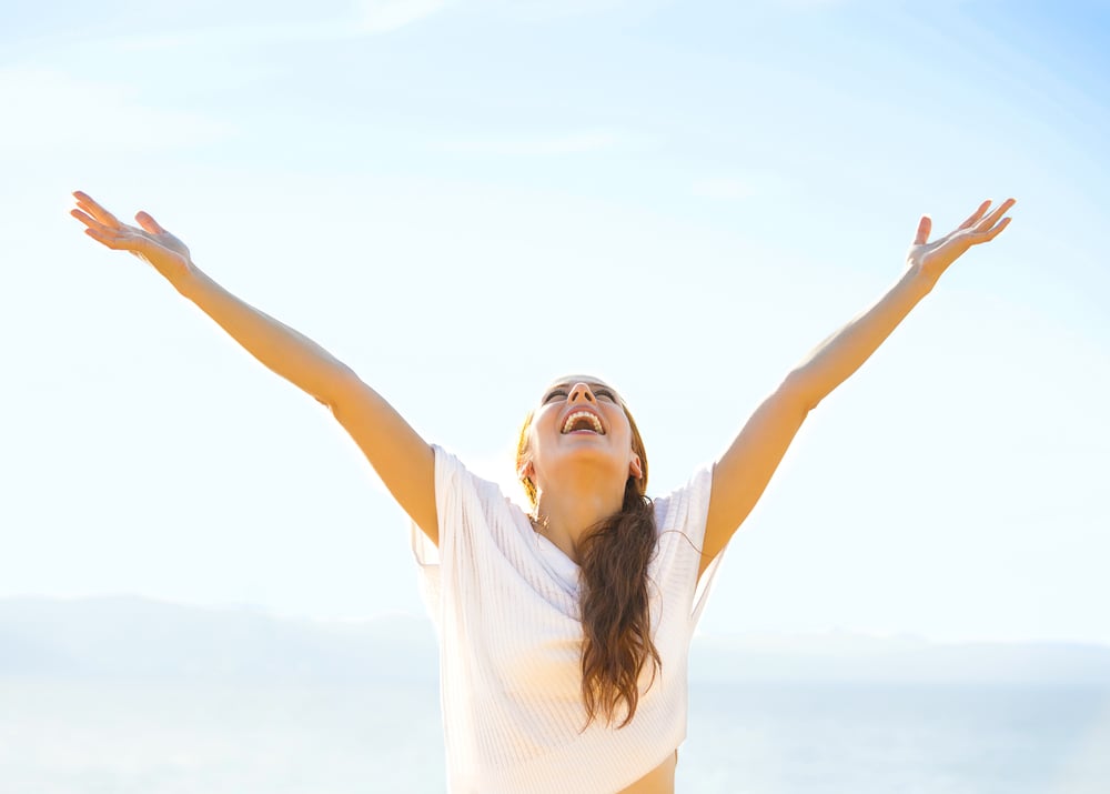 Woman smiling arms raised up to blue sky, celebrating freedom. Positive human emotions, face expression feeling life perception success, peace of mind concept. Free Happy girl on beach enjoying nature-Jul-29-2023-03-56-36-6660-AM