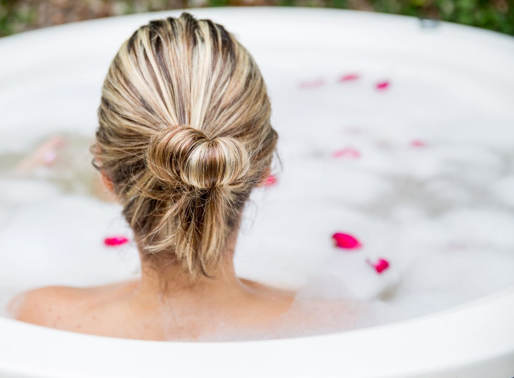 Woman taking a bubble bath - beauty concepts